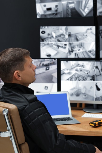 an engineer checking after providing security cameras for business